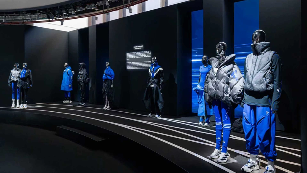 Exhibition showcasing adidas outfits on mannequins. (Photo)
