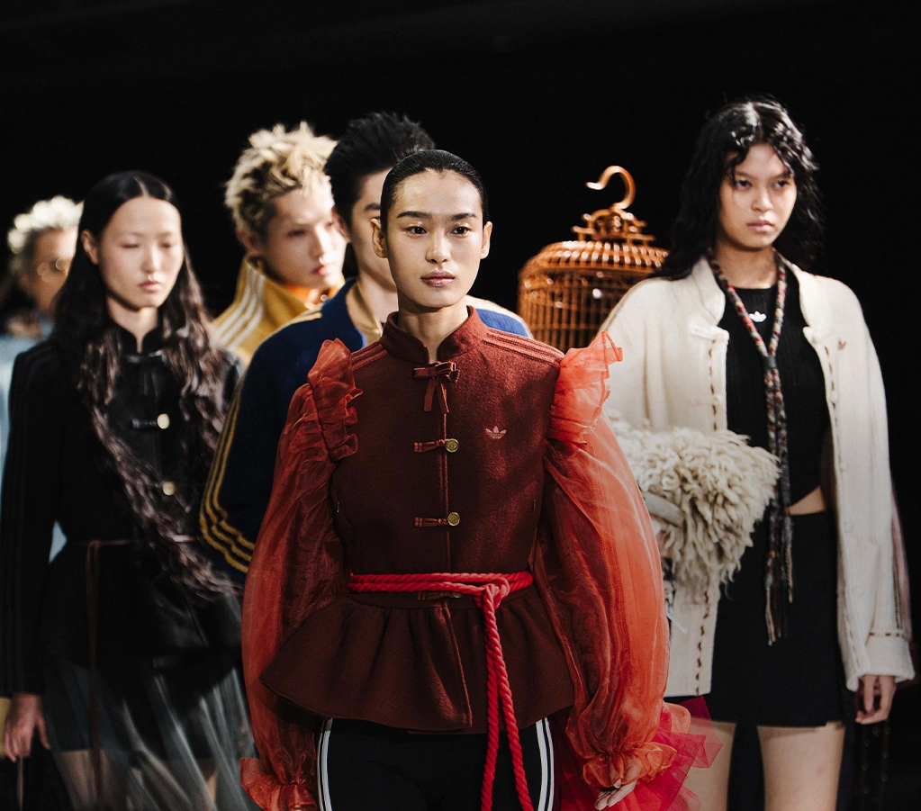 Female Model wearing an adidas jacket outdoors. (Photo)