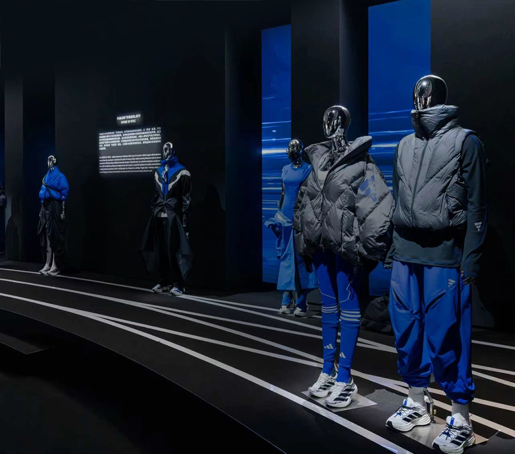 Exhibition featuring adidas outfits on mannequins. (Photo)