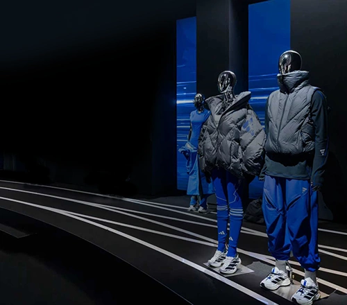 Exhibition featuring adidas outfits on mannequins. (Photo)