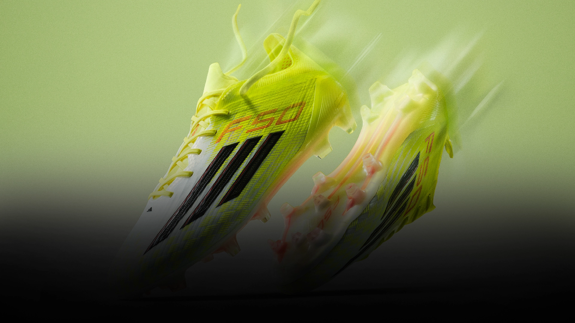 Neon adidas football boots in motion. (Photo)