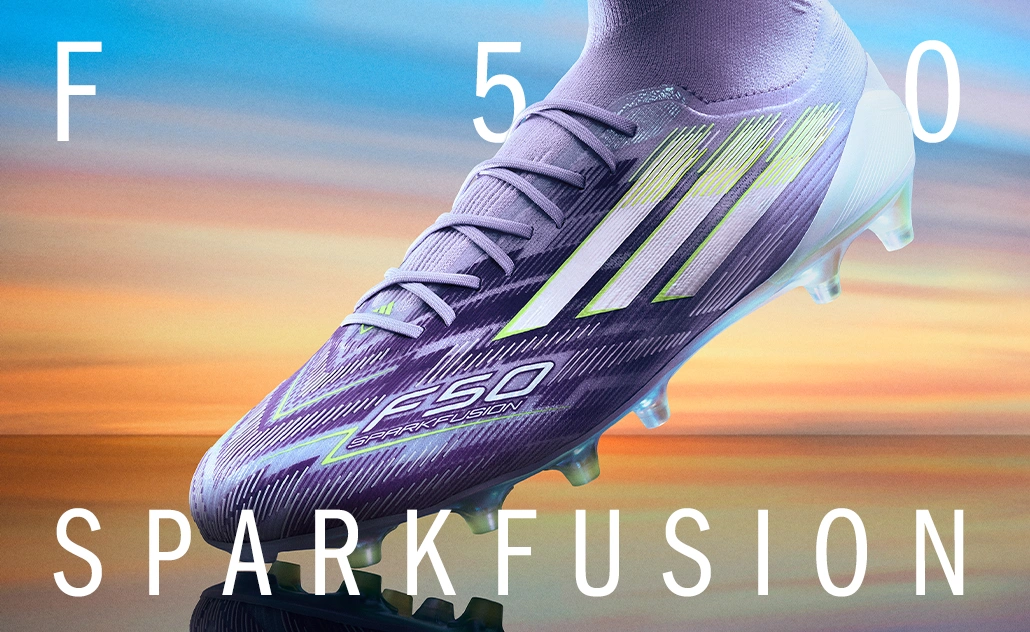 Purple adidas football boot with light stripes and studs against a colorful background, with the text “F50 Sparkfusion.” (Photo)