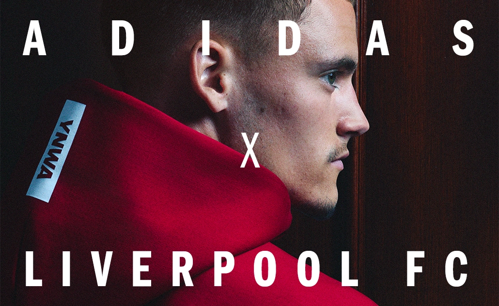 Man in profile wearing red adidas apparel with the text “adidas x Liverpool FC.” (Photo)